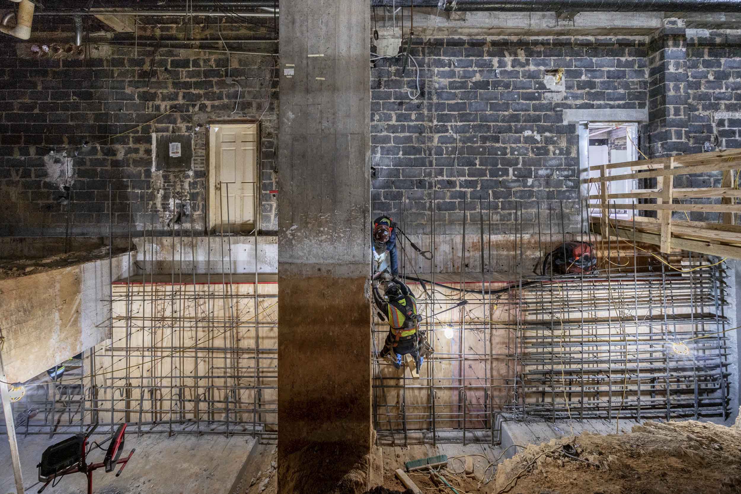 Construction worker framing new walls in Alderman Library