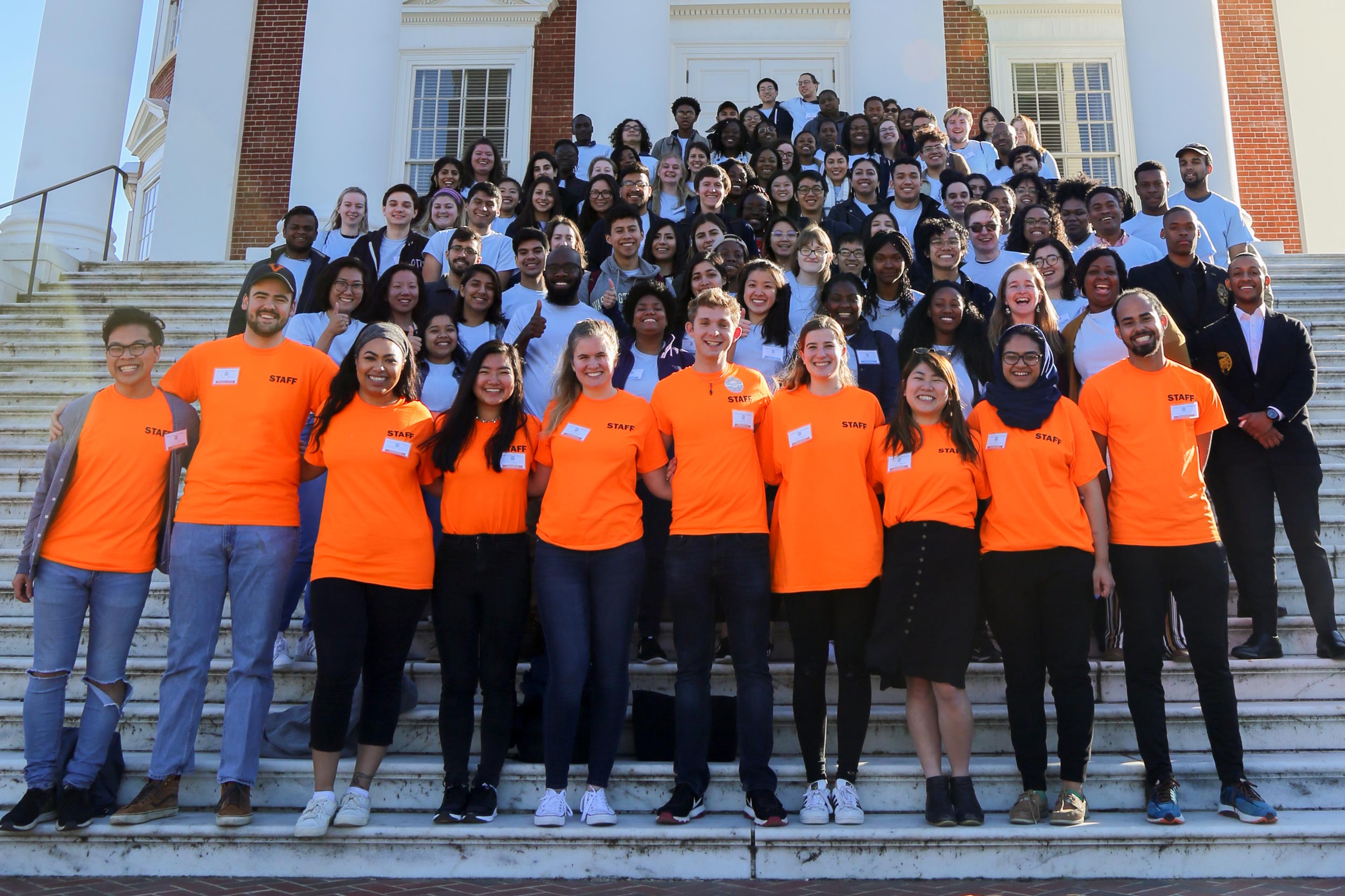 Group photo from a conference on the Rotunda