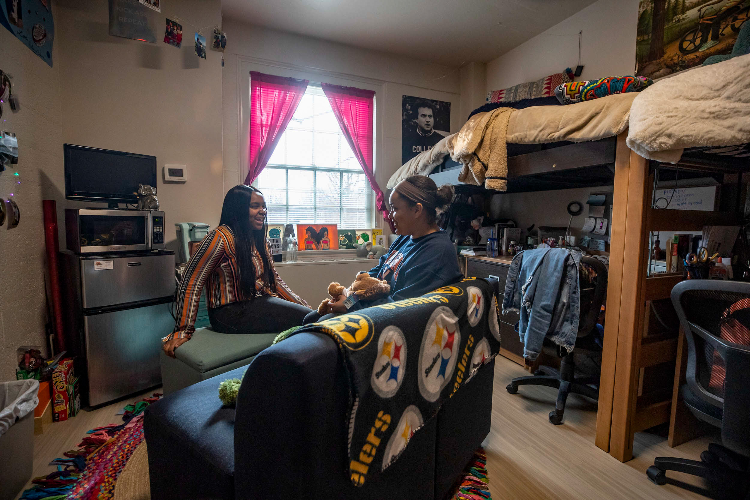 Alita Robinson, left, and Macy Brandon sit in their room chatting