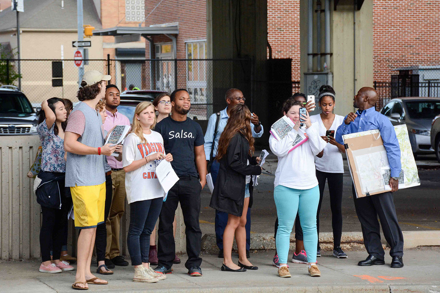 UVA students visit a courtyard mural adjacent to The Avenue Bakery on Pennsylvania Avenue in West Baltimore, an area once known as the \"Harlem of the South.”