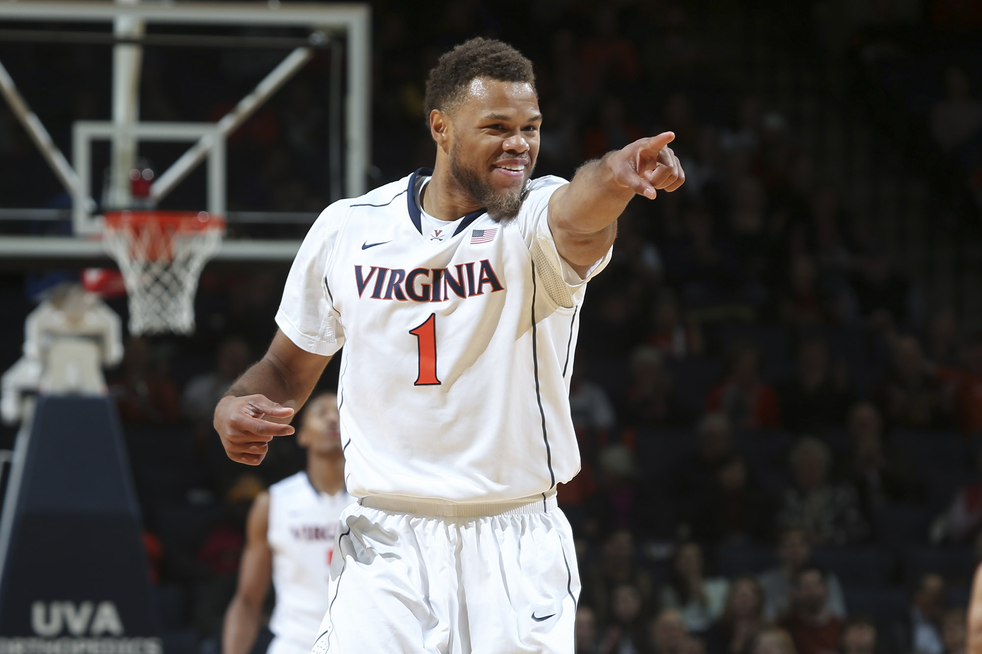 Justin Anderson pointing down the basketball court