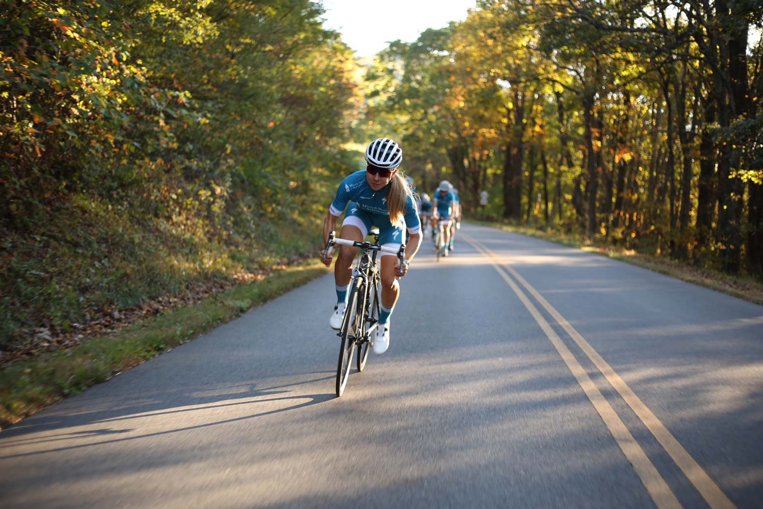 Andrea Dovorak Riding a bicycle in a race