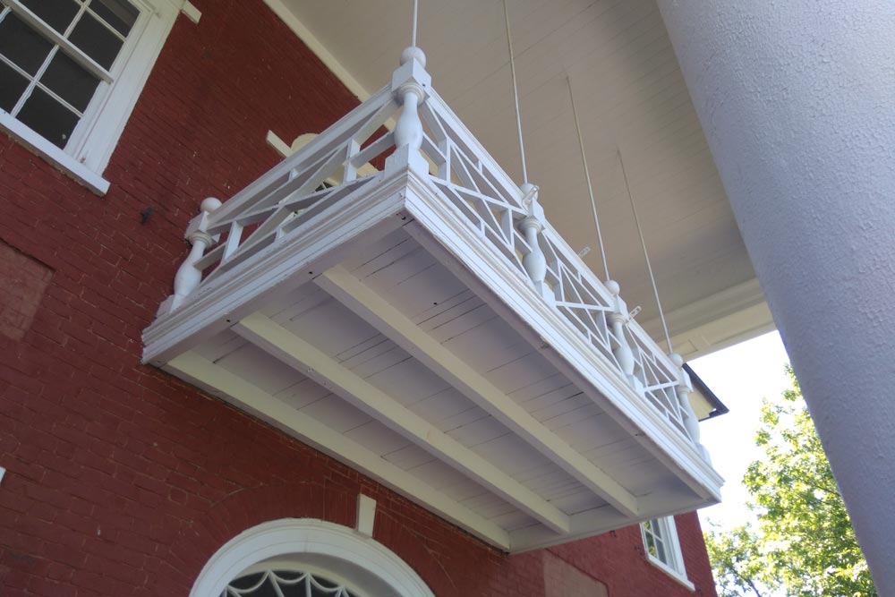 Second floor balcony off of a pavilion building