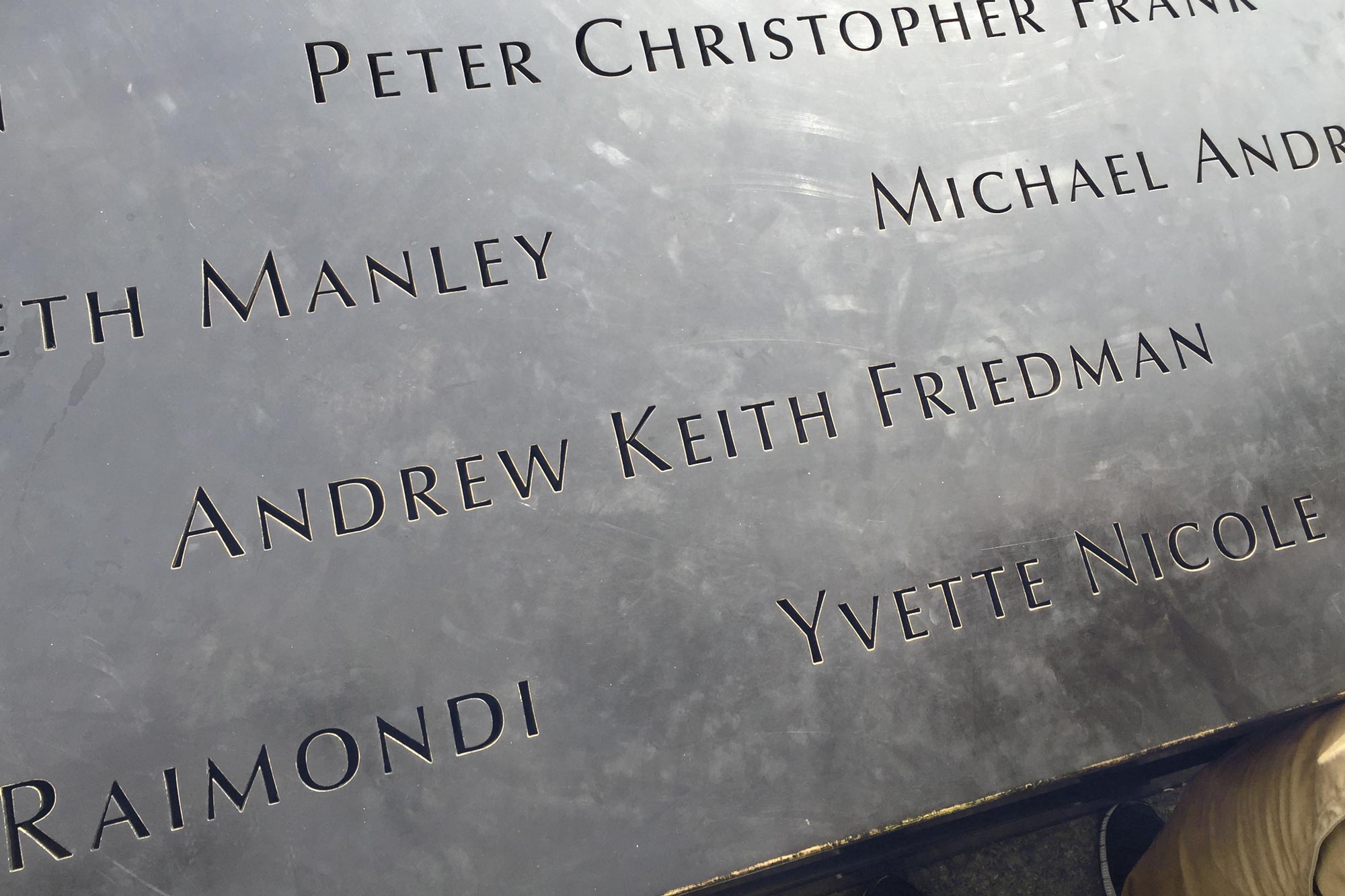 up close image of Andrew Keith Friedman carved into a memorial rock wall