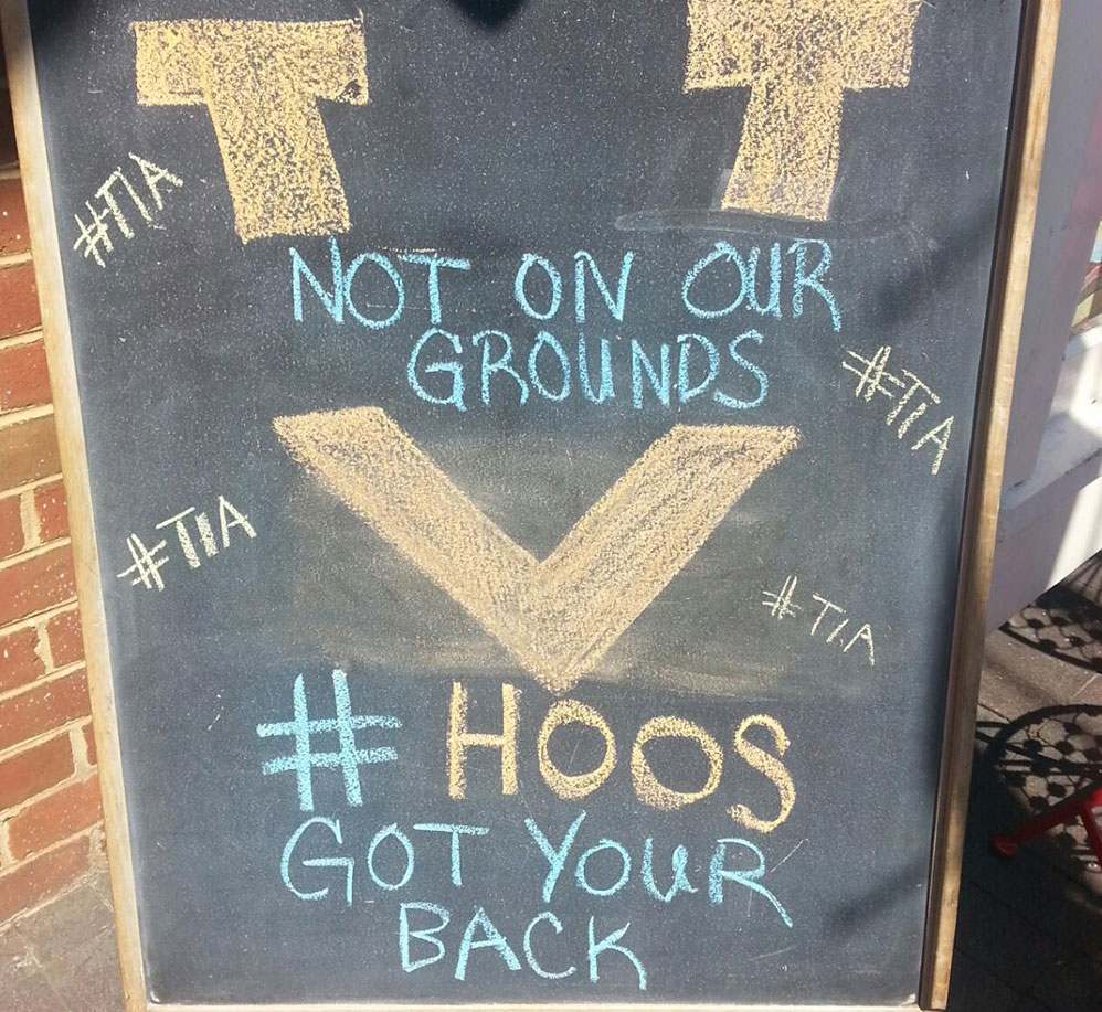 Chalk board sign that says Not on our Grounds #hoos Got your back
