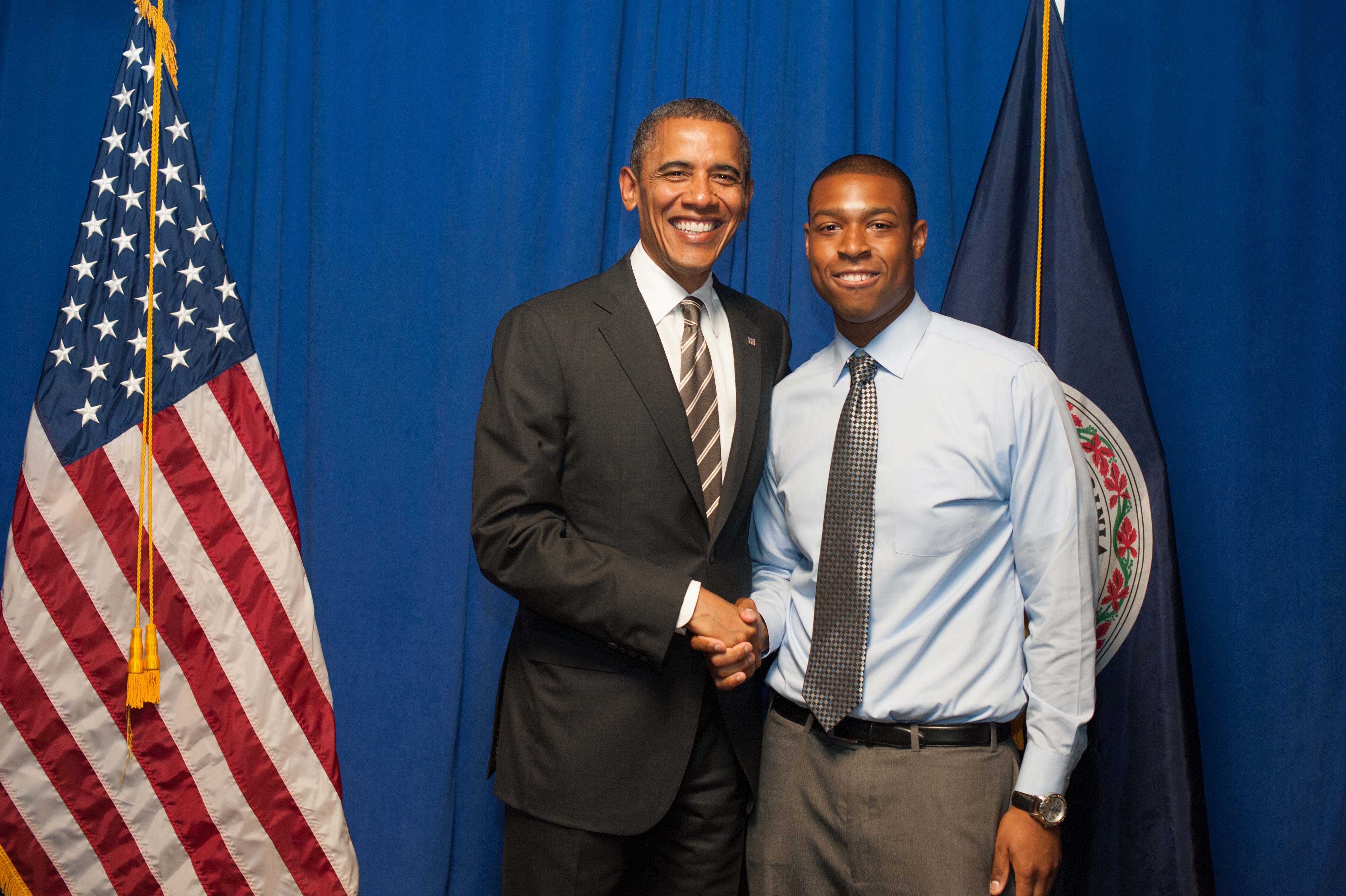 President Obama and U.Va. graduate Edward Smith smile while shaking hands