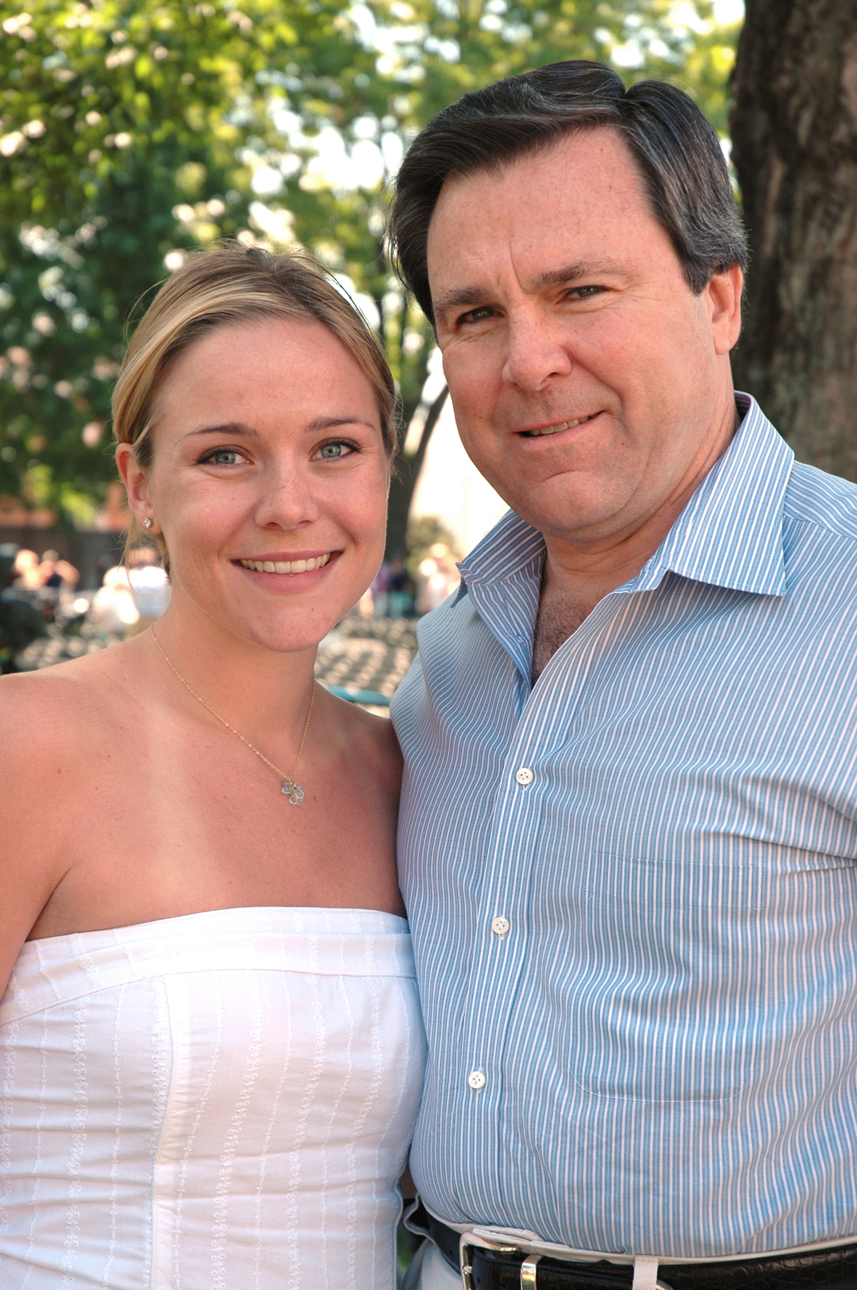 Callan Blount with father, Sherwood stand and smile at the camera on her wedding day