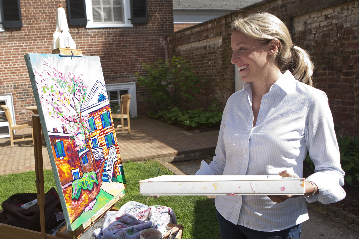 Allison Anderson McKee painting on an easel 