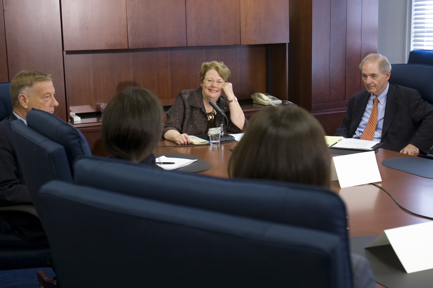 U.Va. President Teresa Sullivan sits at the head of a table at press conference