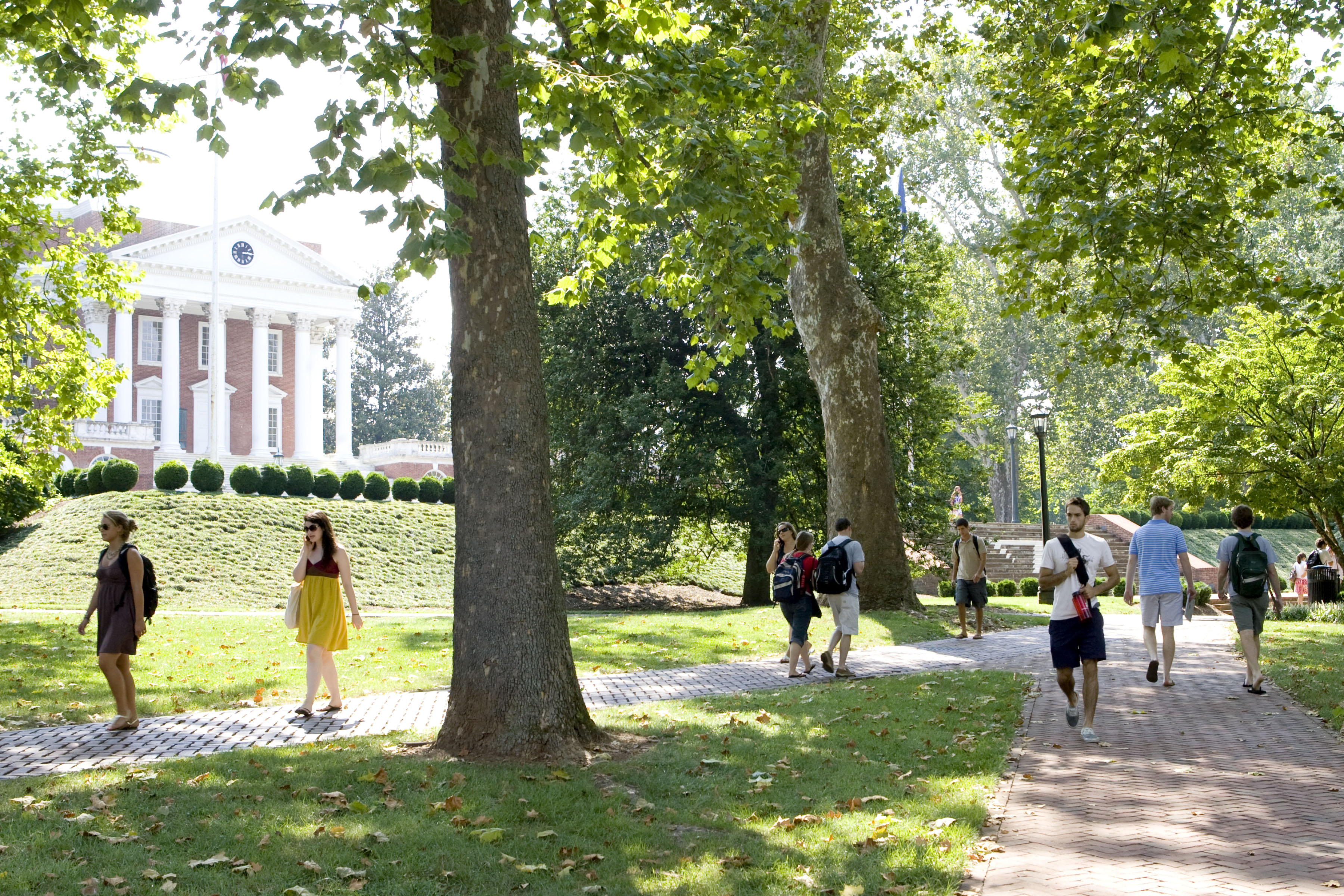 Students walk past U.Va.'s Rotunda on sidewalks