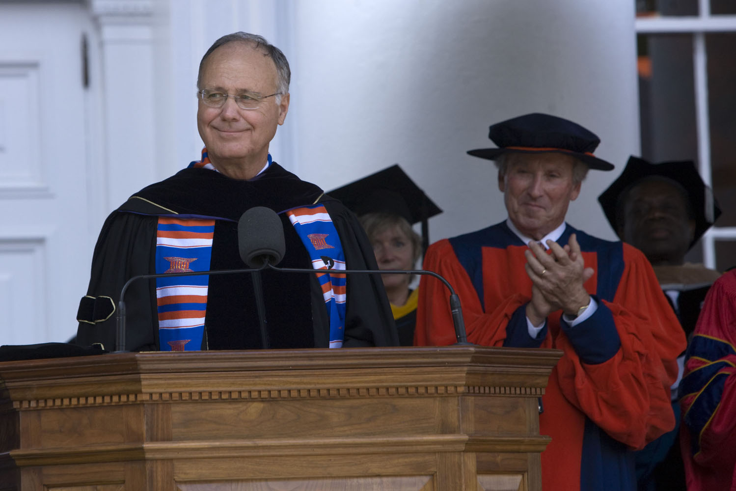 John T. Casteen III stands at a podium doing graduation giving a speech
