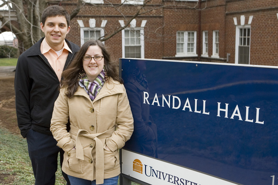 Ian Dominiguez and Rachel Baker stand outside the sign of Randall Hall