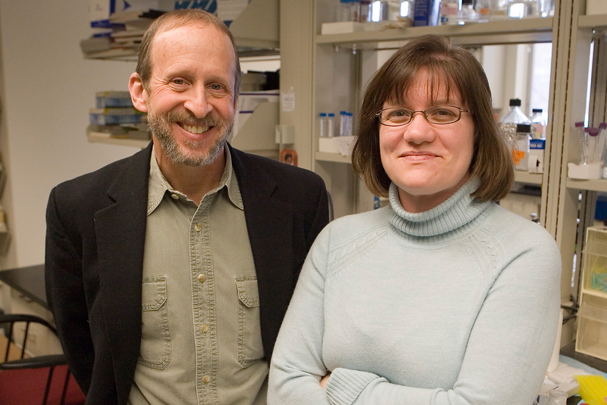 George Bloom and Michelle King stand next to each other in the lab