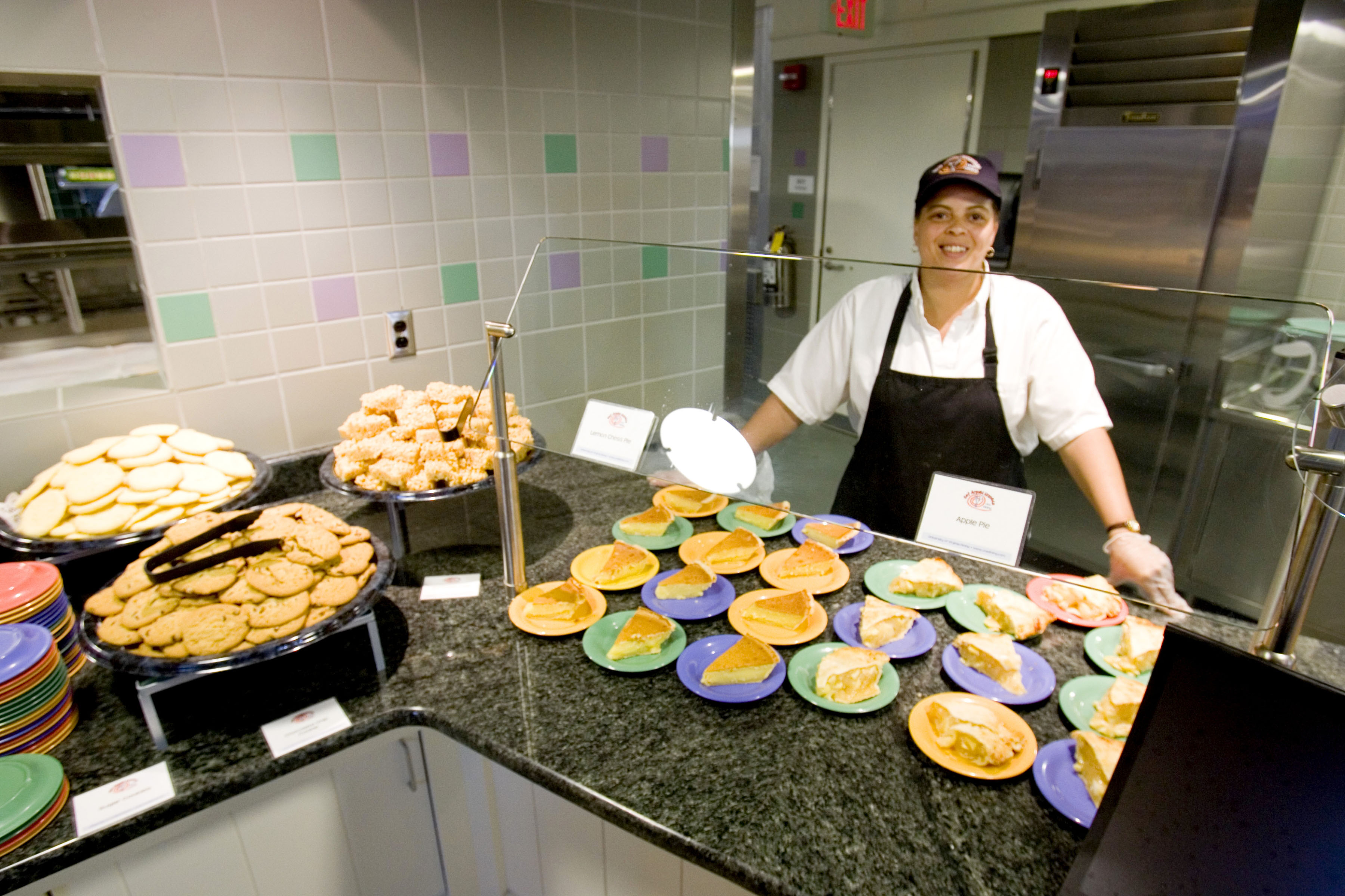 UVA chef stands behind deserts at a UVA dining hall station