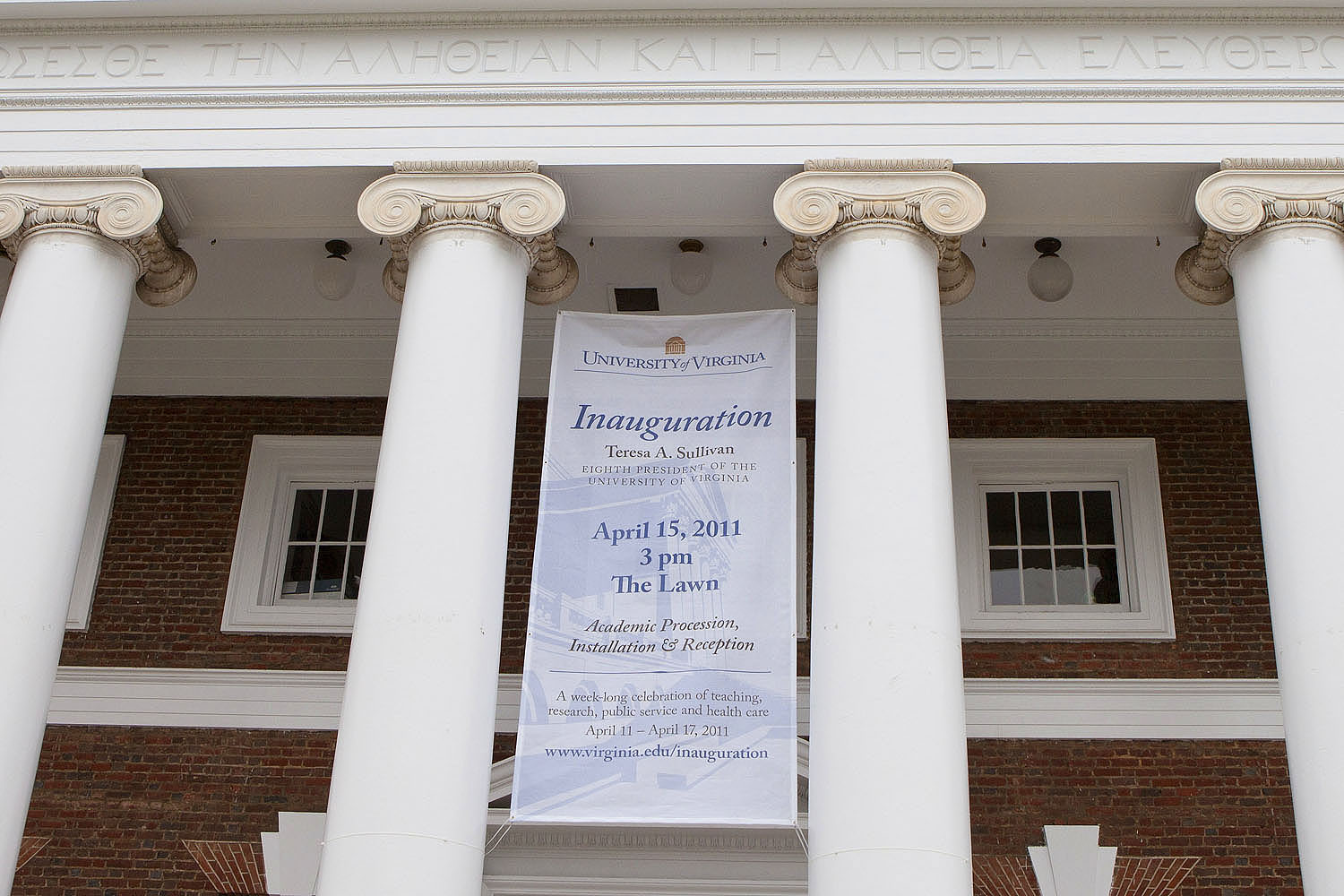 Inaugural banner hanging between the columns of Old Cabell Hall