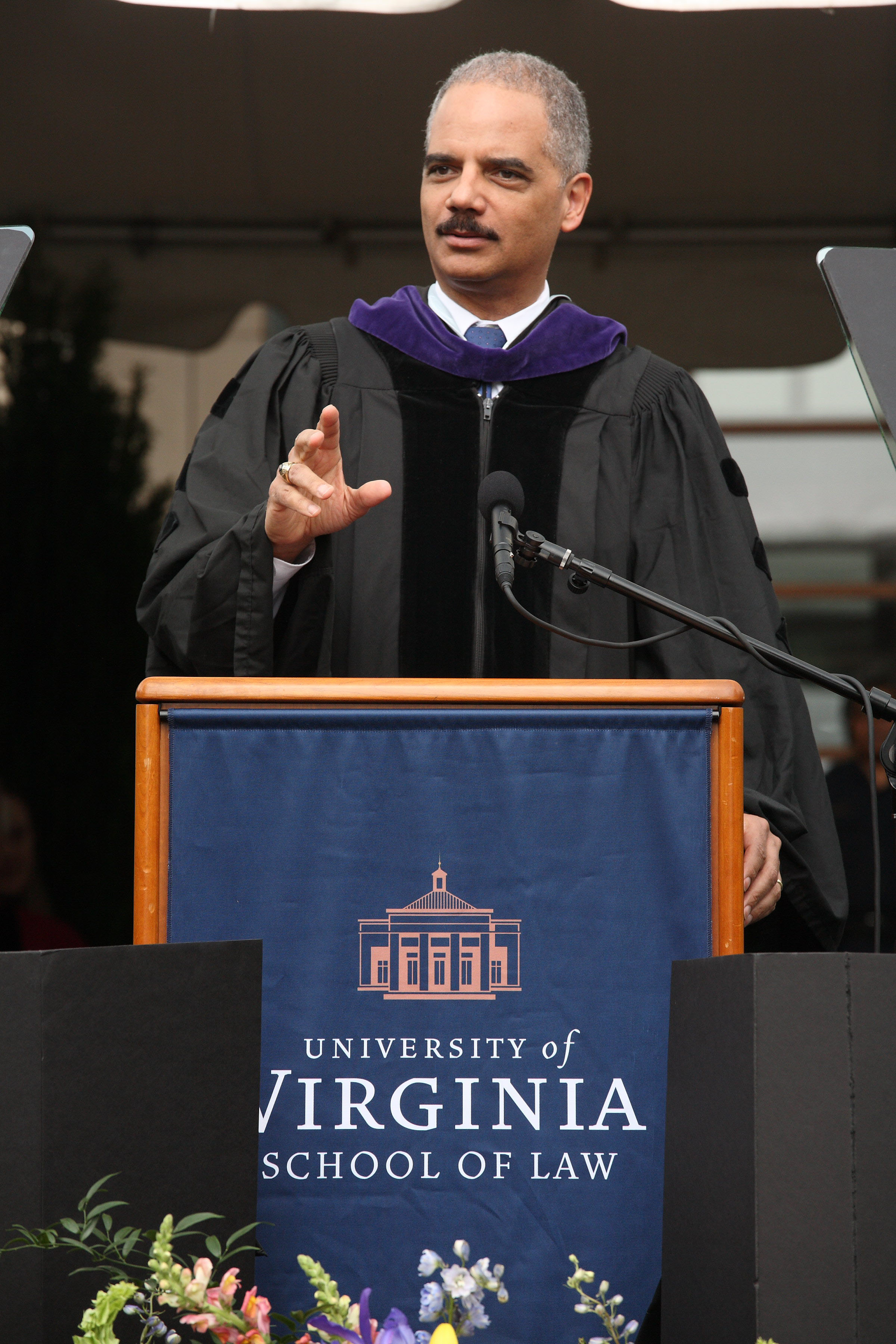 U.S. Attorney General Eric Holder speaking at a podium