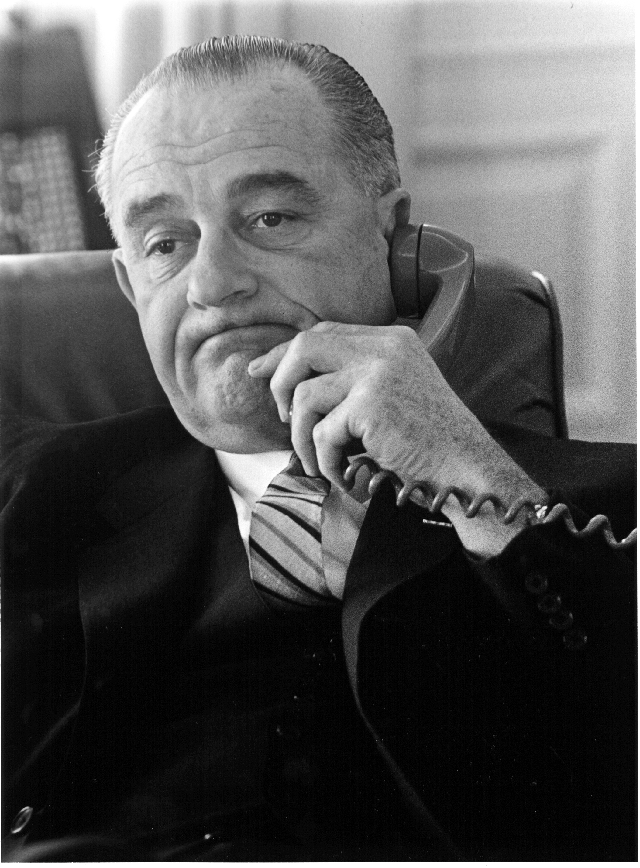 Lyndon B. Johnson talking on a phone
