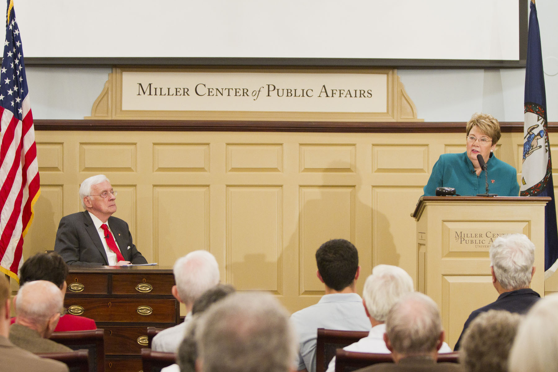 Teresa A. Sullivan talks to a crowd from a podium