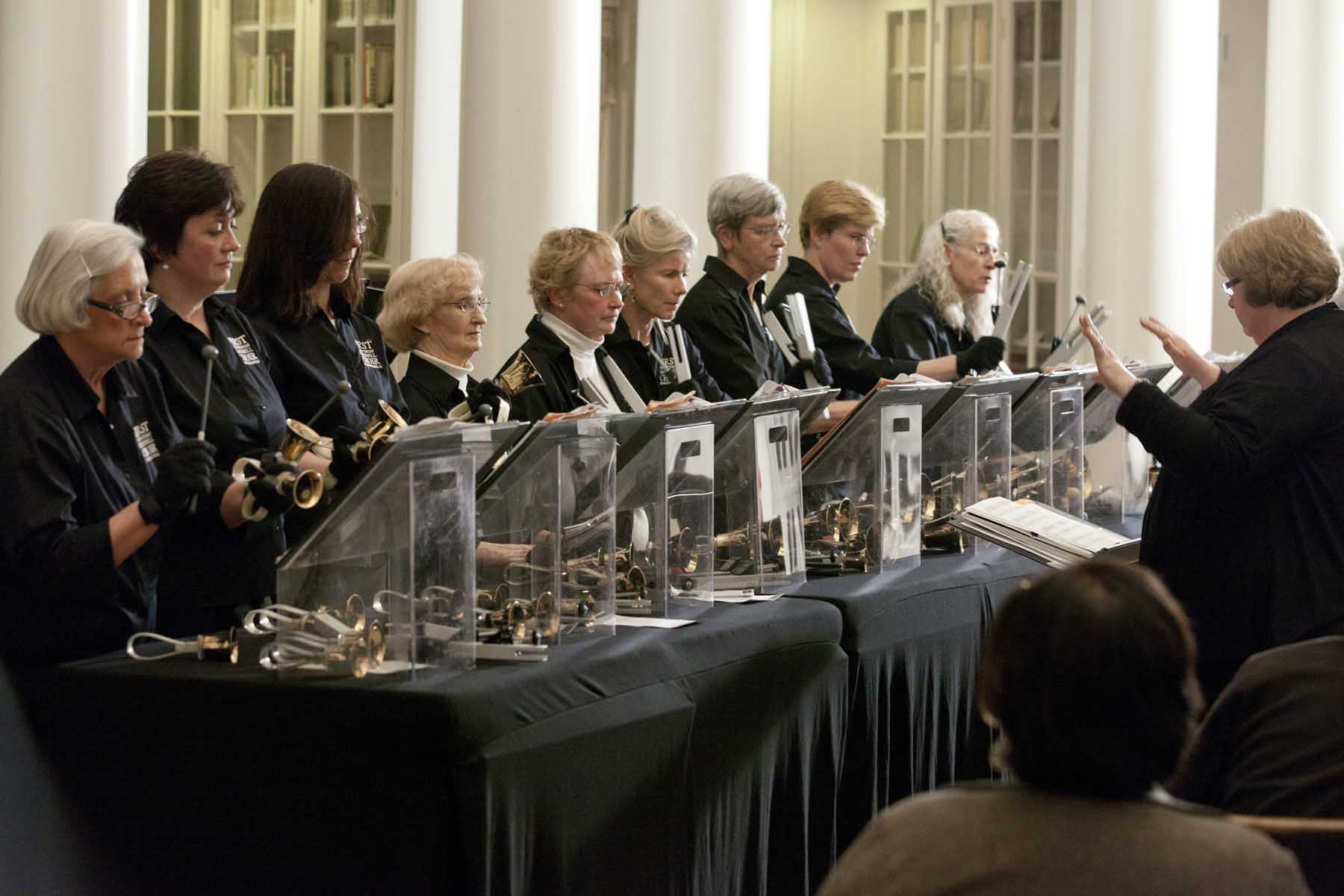 The handbell choir of Charlottesville performing for a crowd