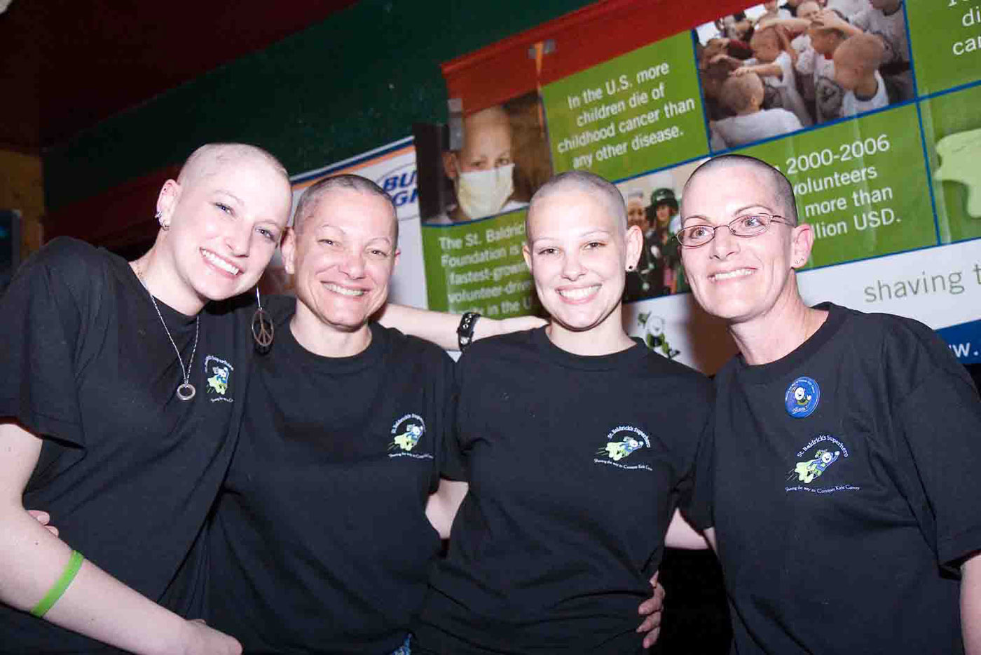 Group photo of St. Baldrick's Day participants Katherine Henshaw, Donna Henshaw, Erin Henshaw and Ruth Poole-Henshaw 