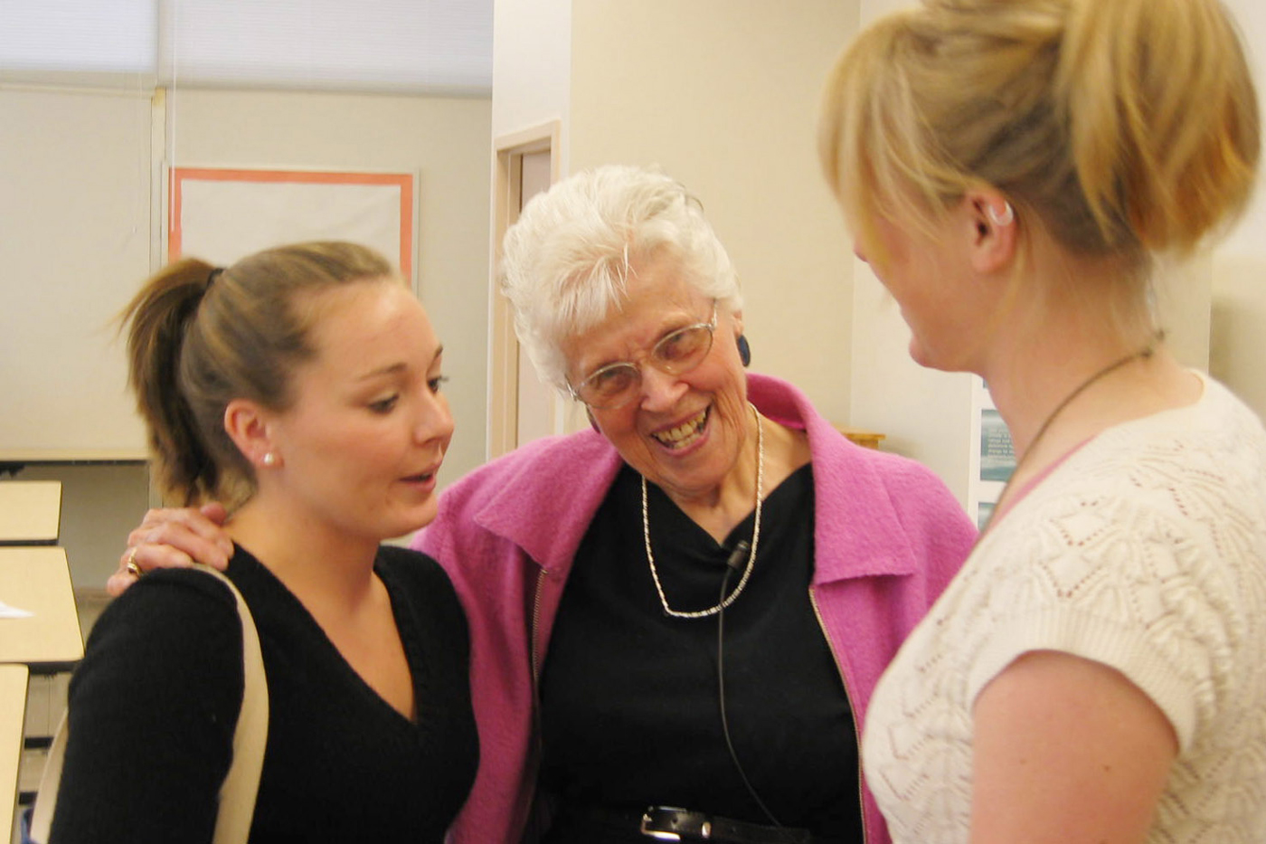 Charlene Jeffries (left) and Anna Mapes talk with Grace O'Brien