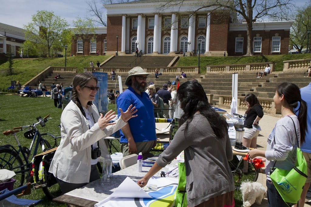 People talk to presentation tables about Earth Day