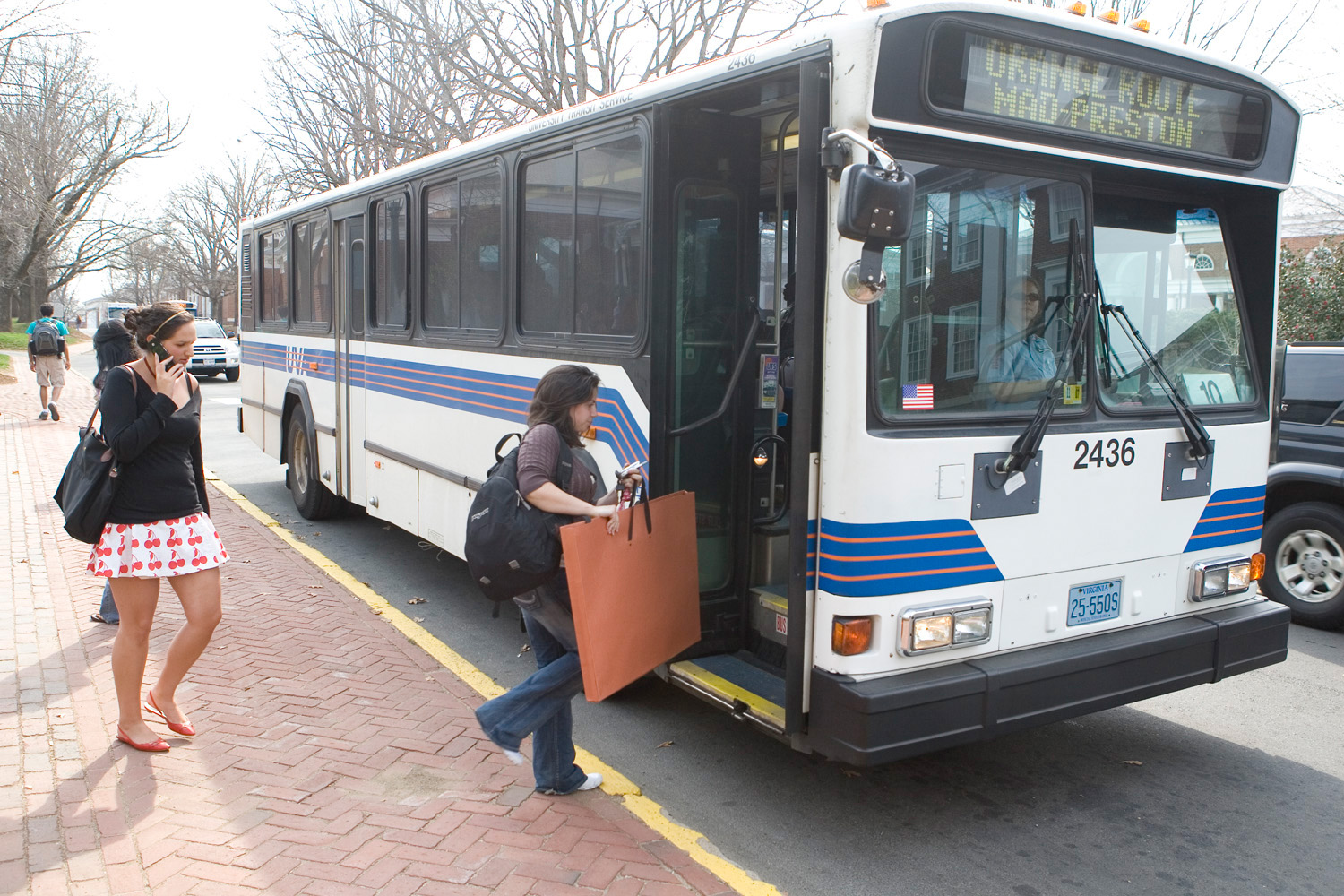Students boarding a UVA bus