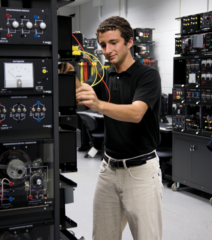 Greg Troyer working on equipment in a lab