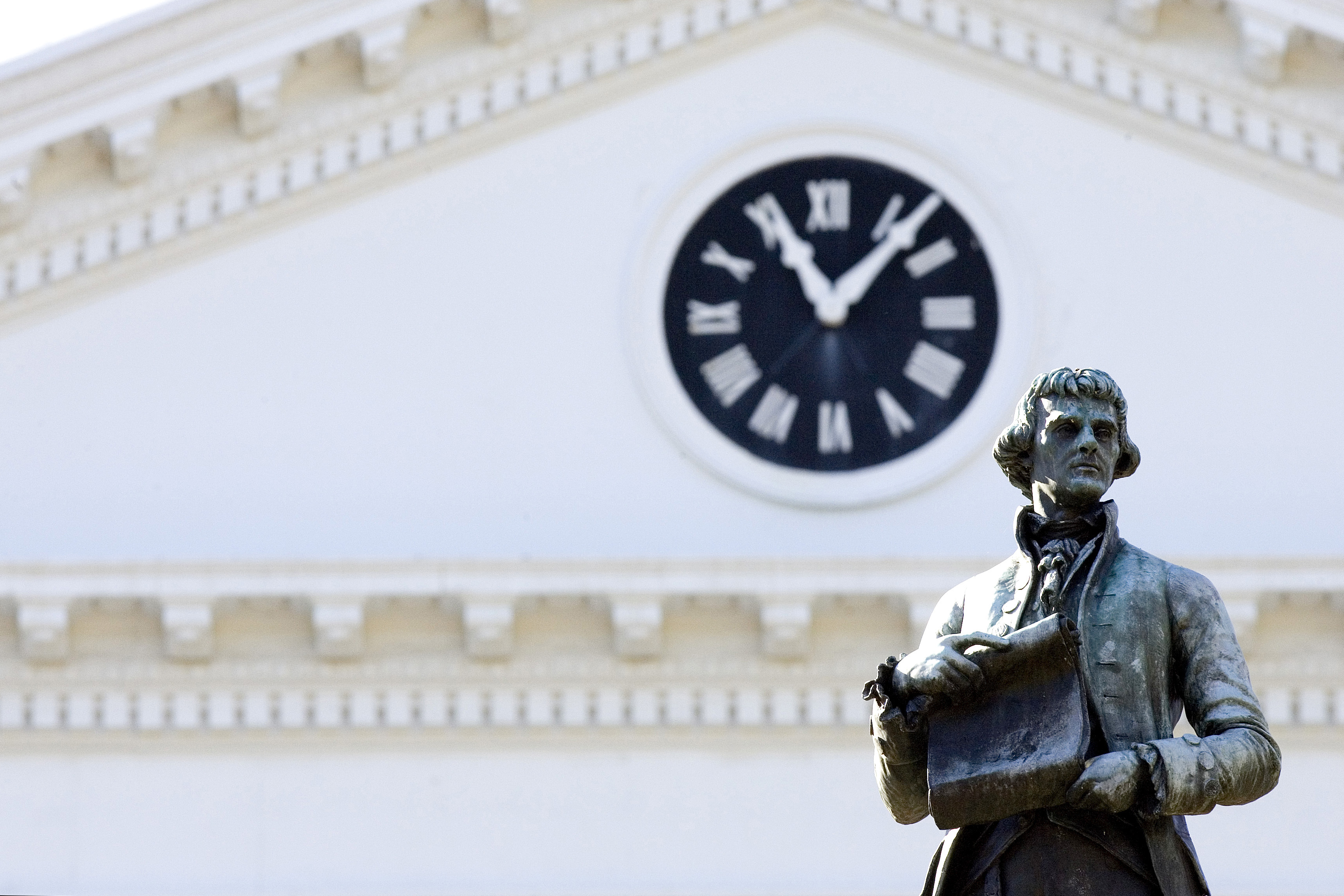 Thomas Jefferson statue in front of the Rotunda clock