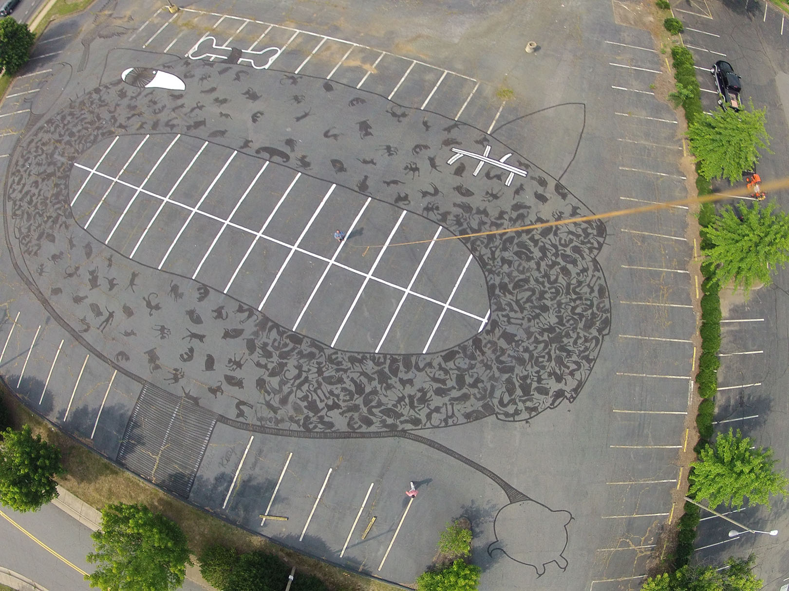 Aerial view of art work drawn on a parking lot