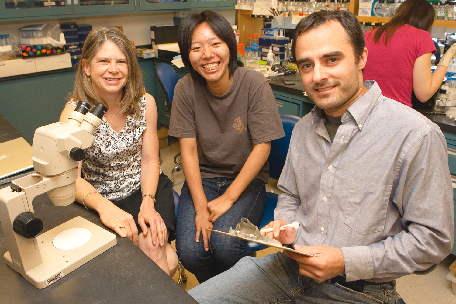 Carla Green, Shihoko Kojima and Nicholas Douris work together in a lab