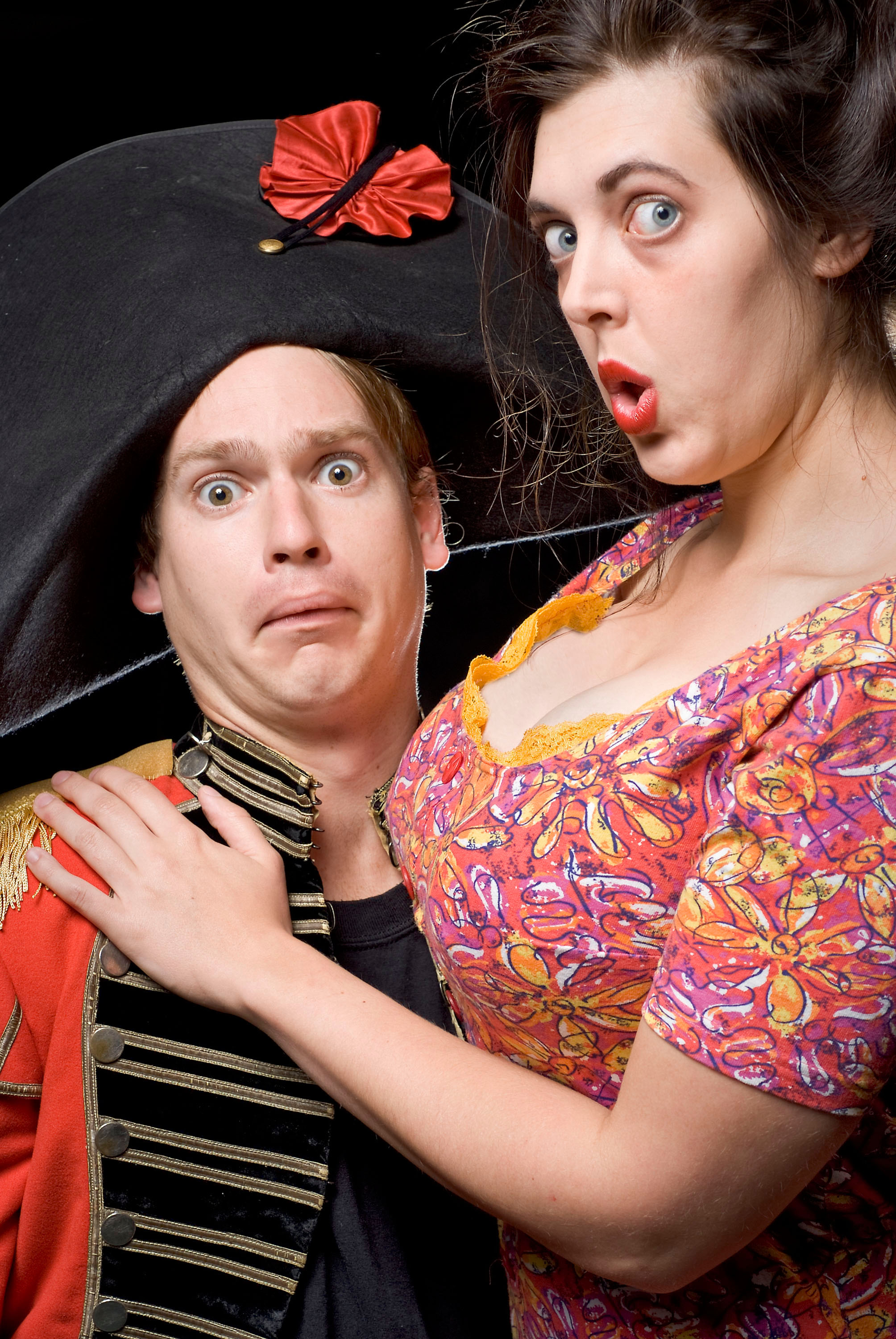 A Man holds a women during a scene in a play