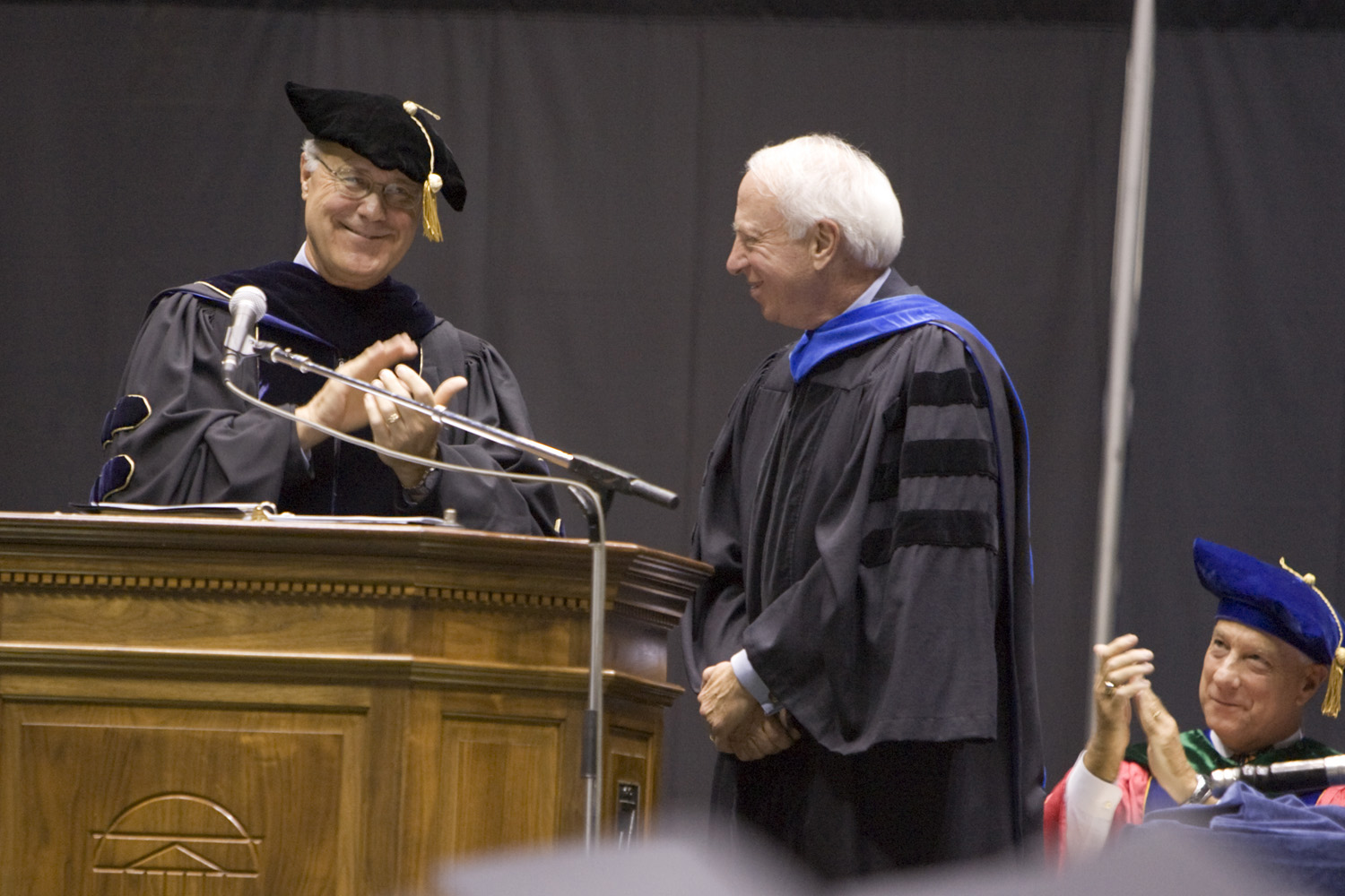 Richard Bonnie, right,  recieving an award while President Casteen claps on stage