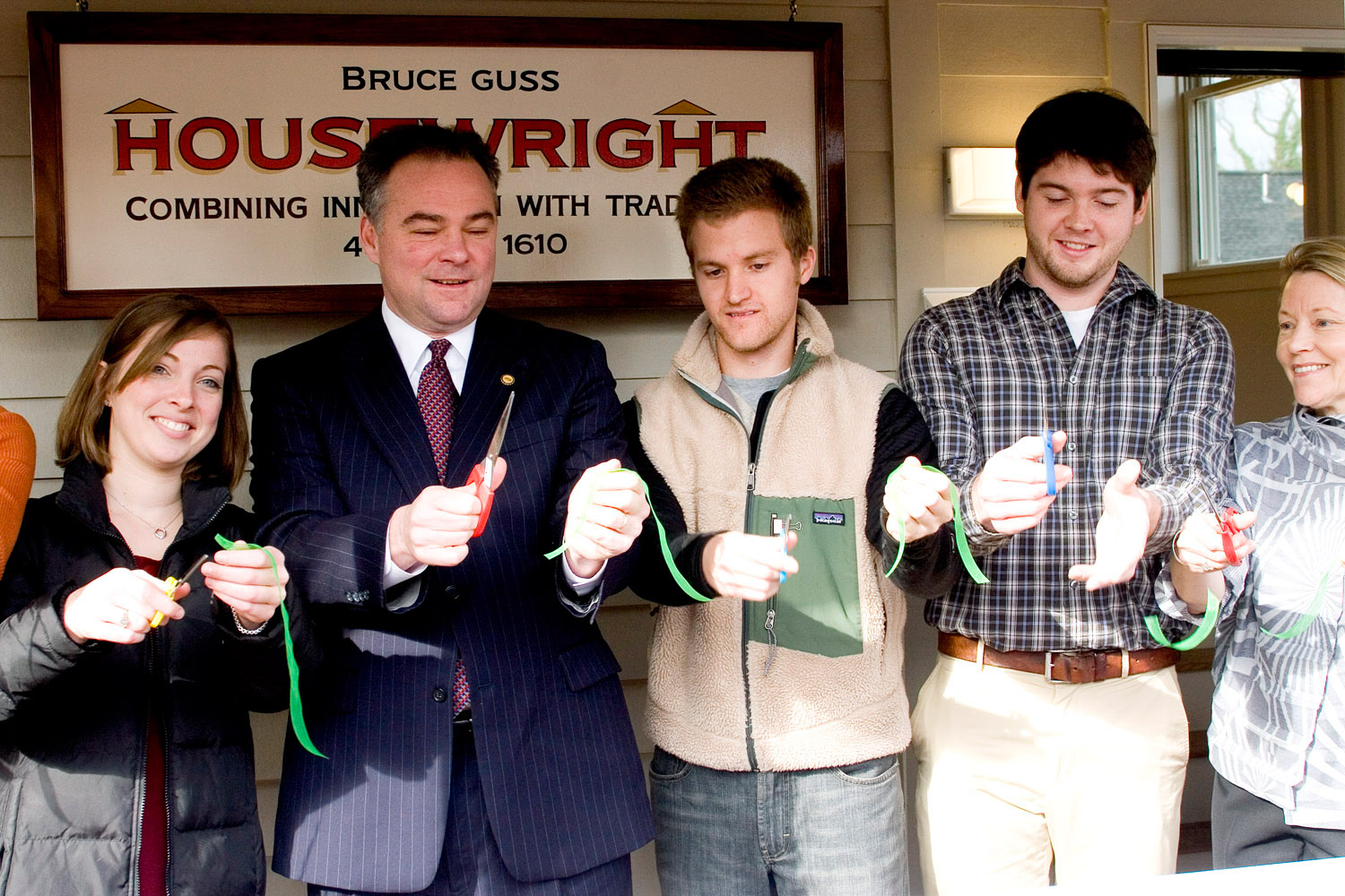 Gov. Timothy Kaine cuts a ribbon with a group of people