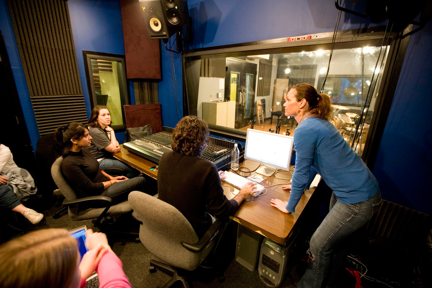 Heather Maxwell talking to students in a recording studio