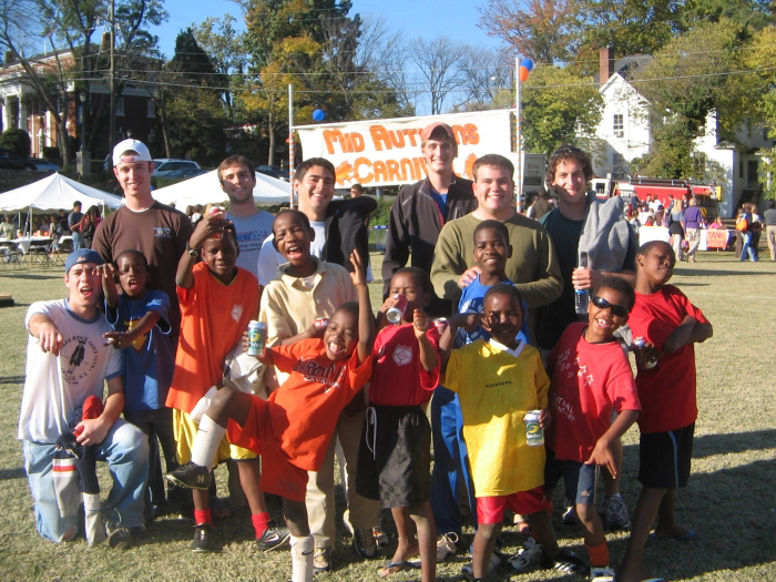 UVA students and little children pose for a photo