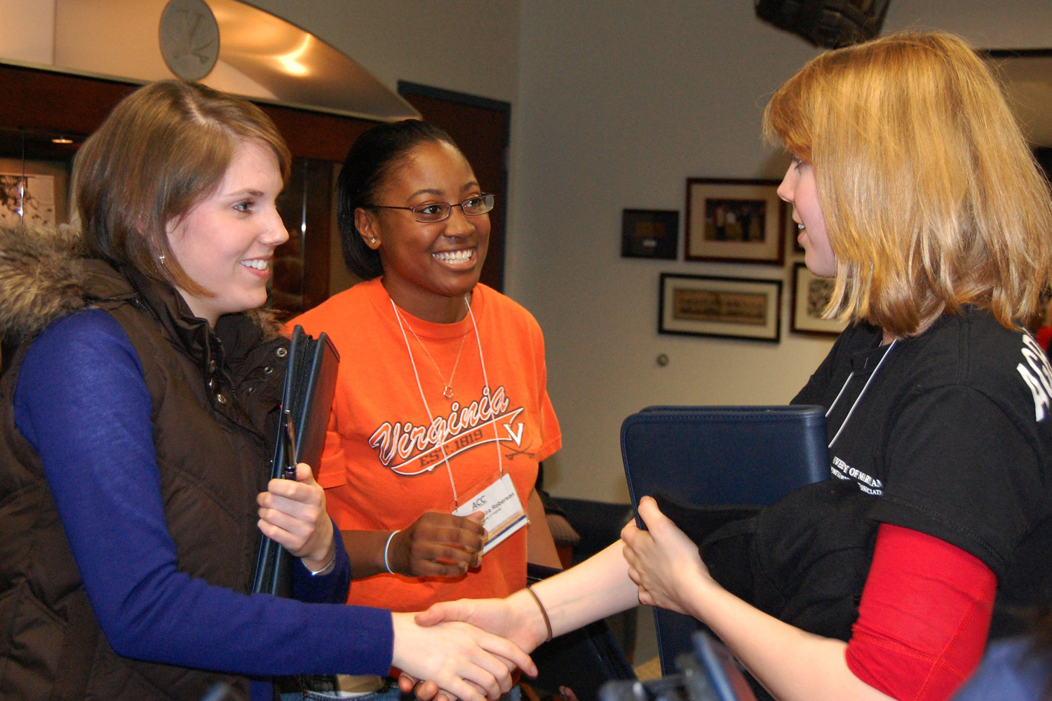 Meg Barry and Tamira Roberson introduce themselves to a University of Maryland student