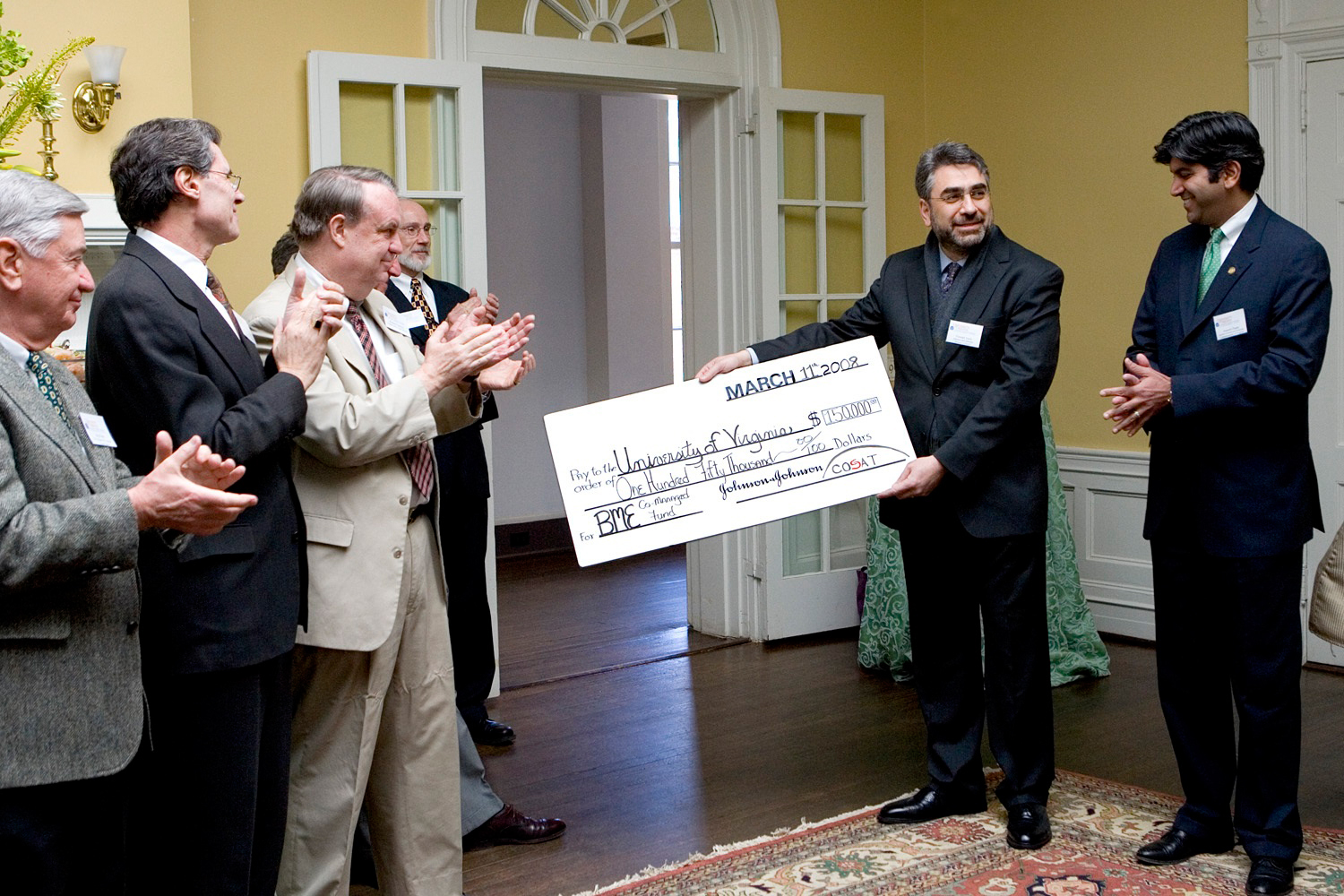 Youseph Yazdi, presents a 150,000 dollar donation to UVA executive staff