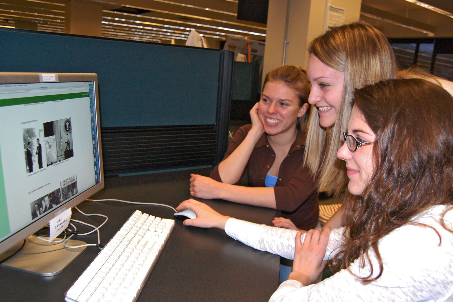 Zoe Neale, Erica Litovitz and Teri Dulong-Rae work on a computer together