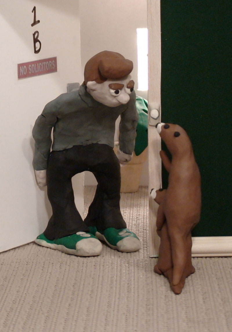 Clay figurines of a person and a beaver