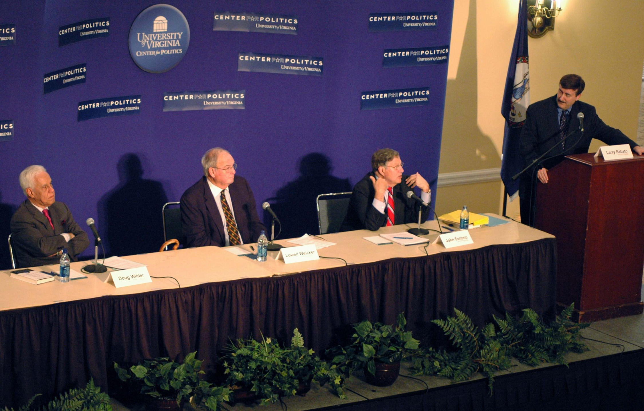 Panelists Left to right: Doug Wilder, Lowell Weicker and John Sununu, with Moderator Larry Sabato standing at a podium