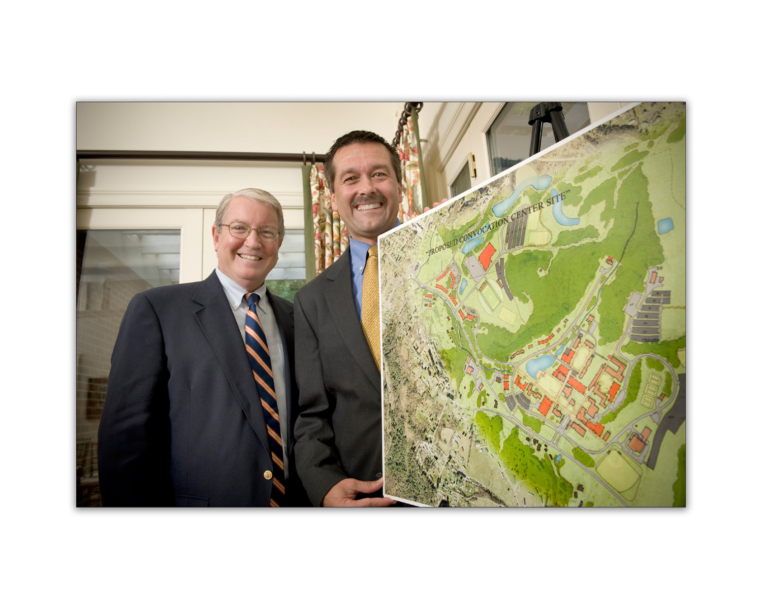 David J. Prior and Terry Kilgore hold a map of future expansions at UVA
