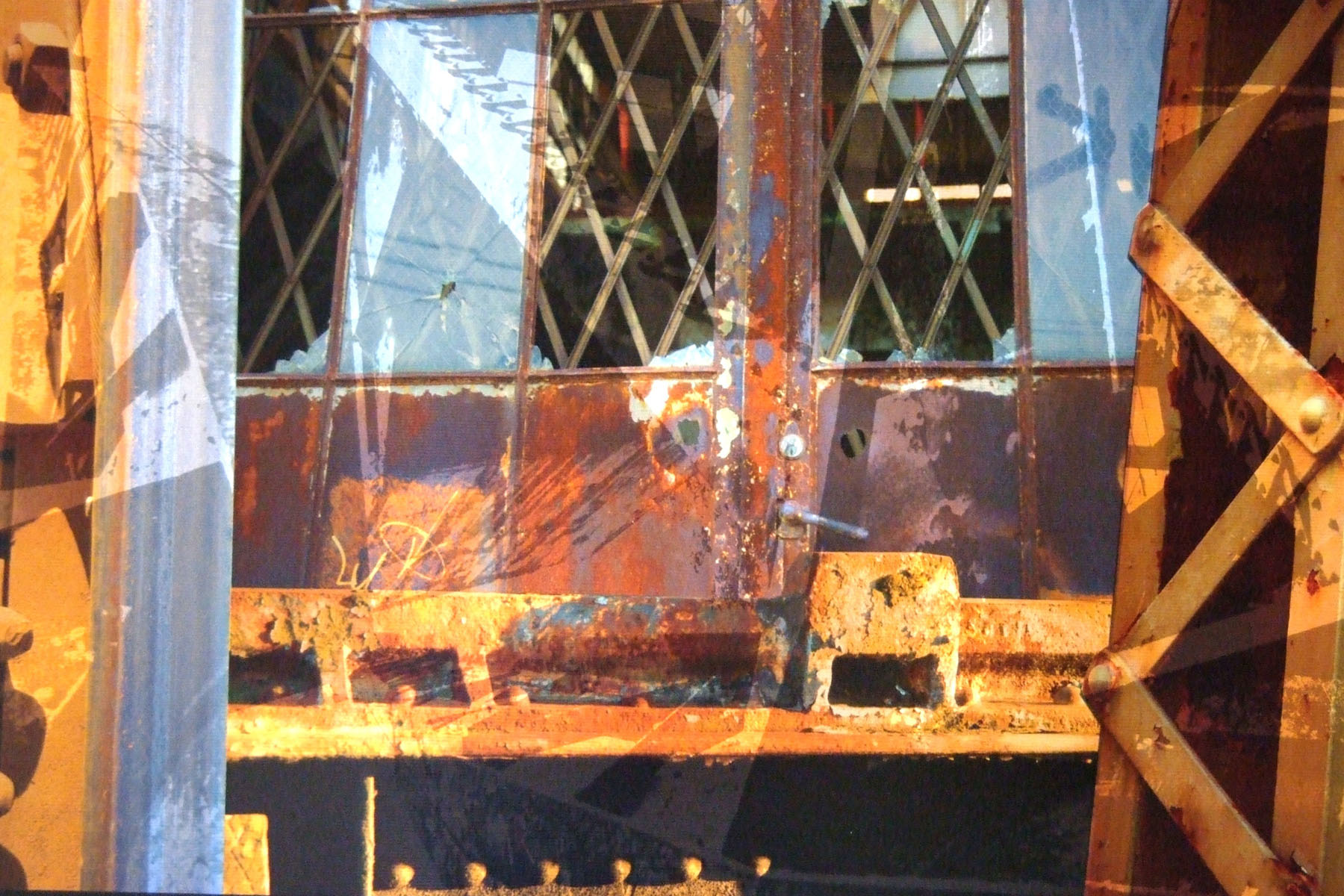 Rusted beams of a building that has no glass in the windows