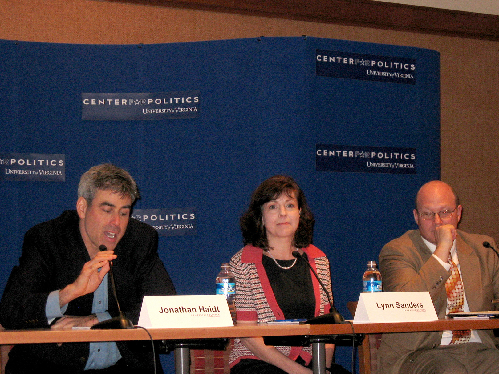 Panelists sitting at a table answering questions