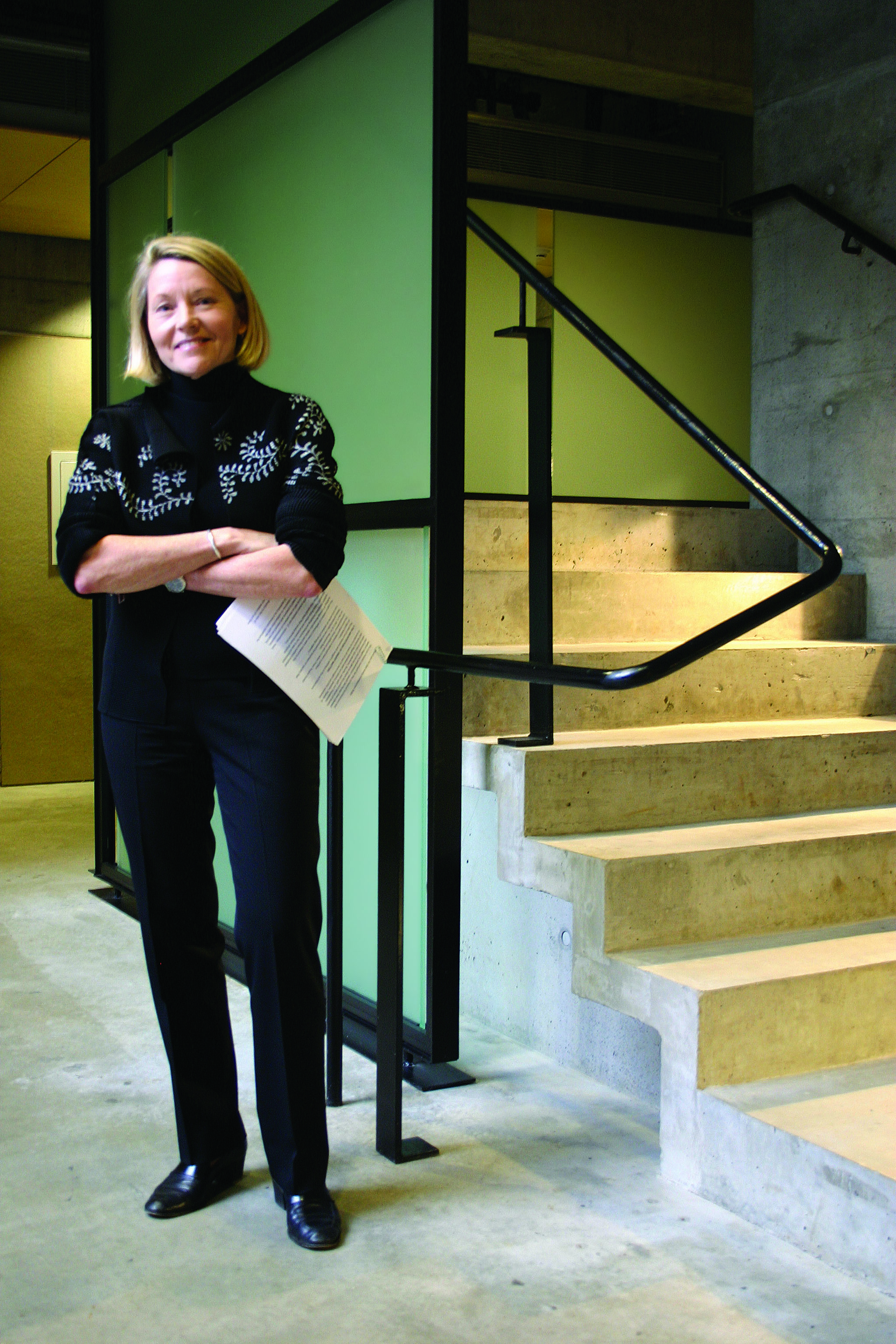 Karen Van Lengen stands next to a staircase