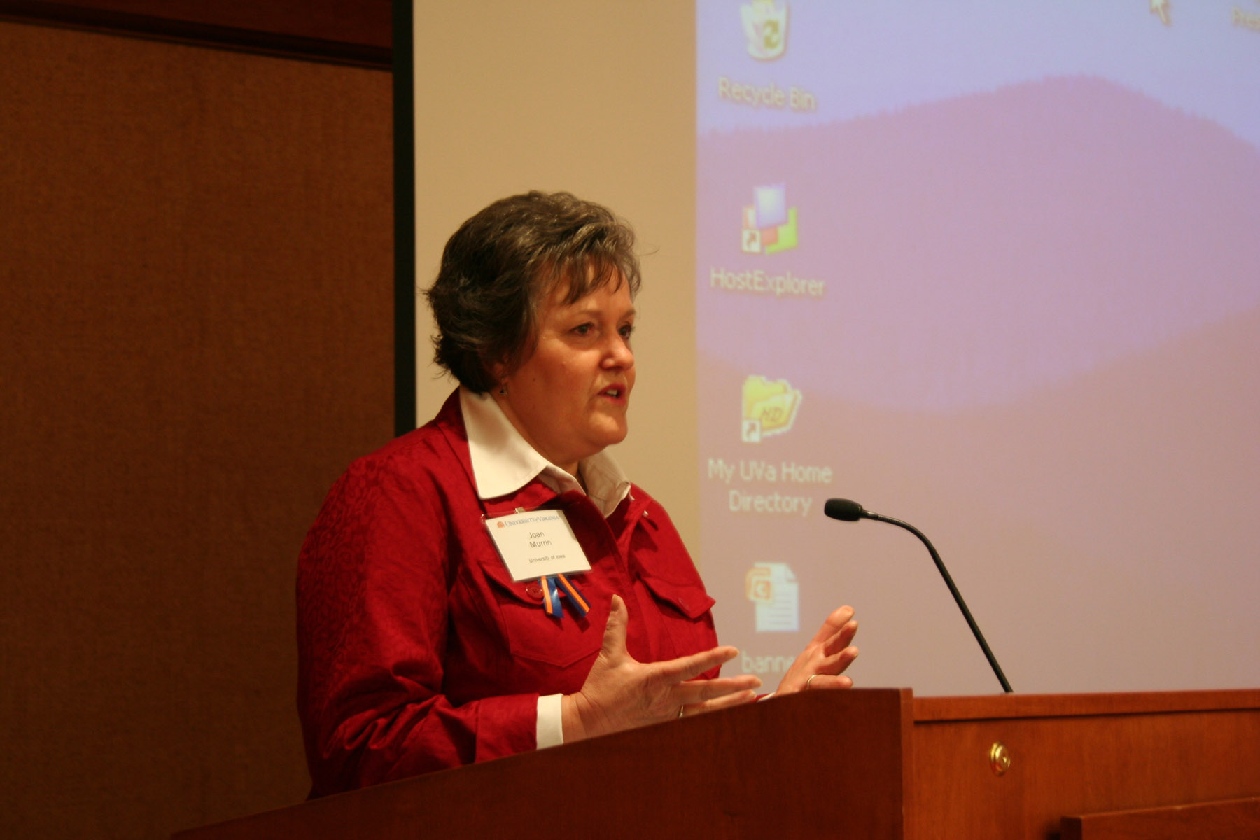 Joan Murrin speaking from a podium