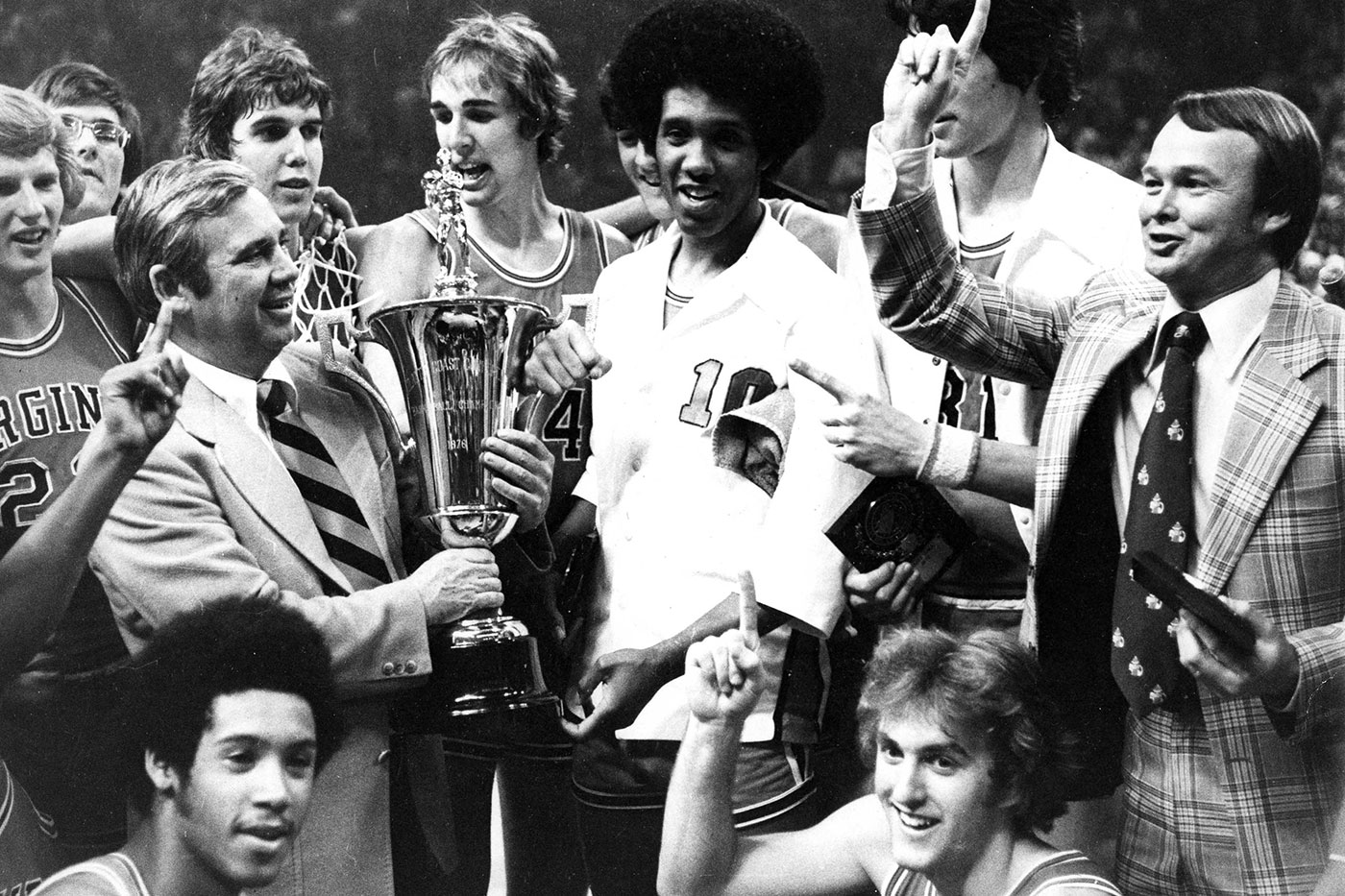 UVA Basketball team celebrates after ACC Tournament championship. Black and white image