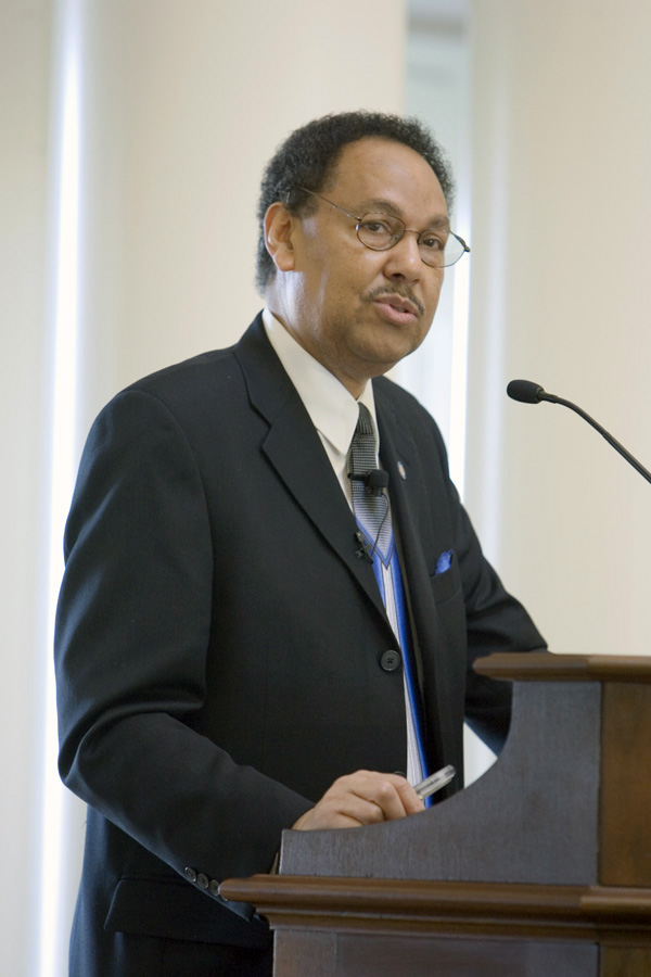 Henry L. Johnson speaking to a crowd from a podium