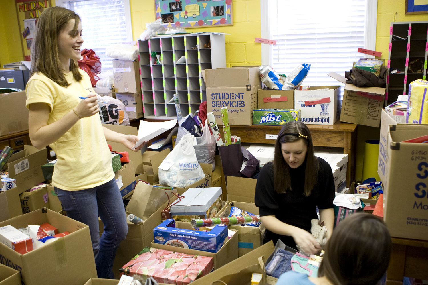 Students organize boxes of donations