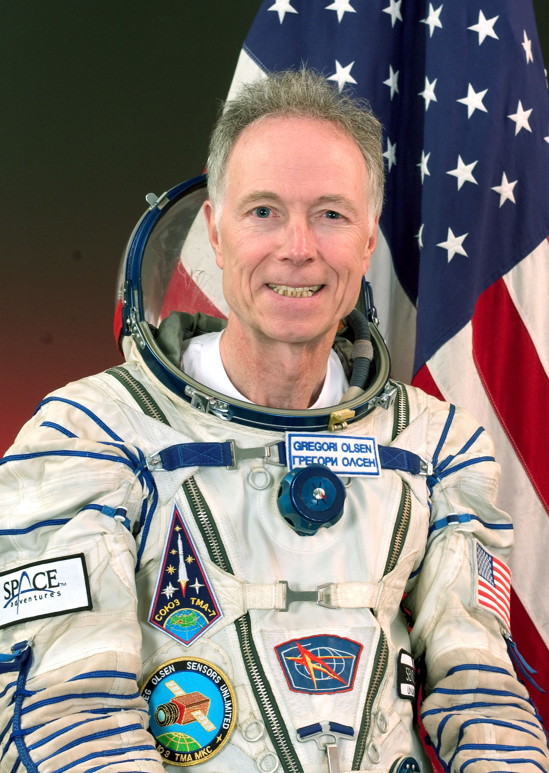 Greg Olsen headshot in astronaut Uniform